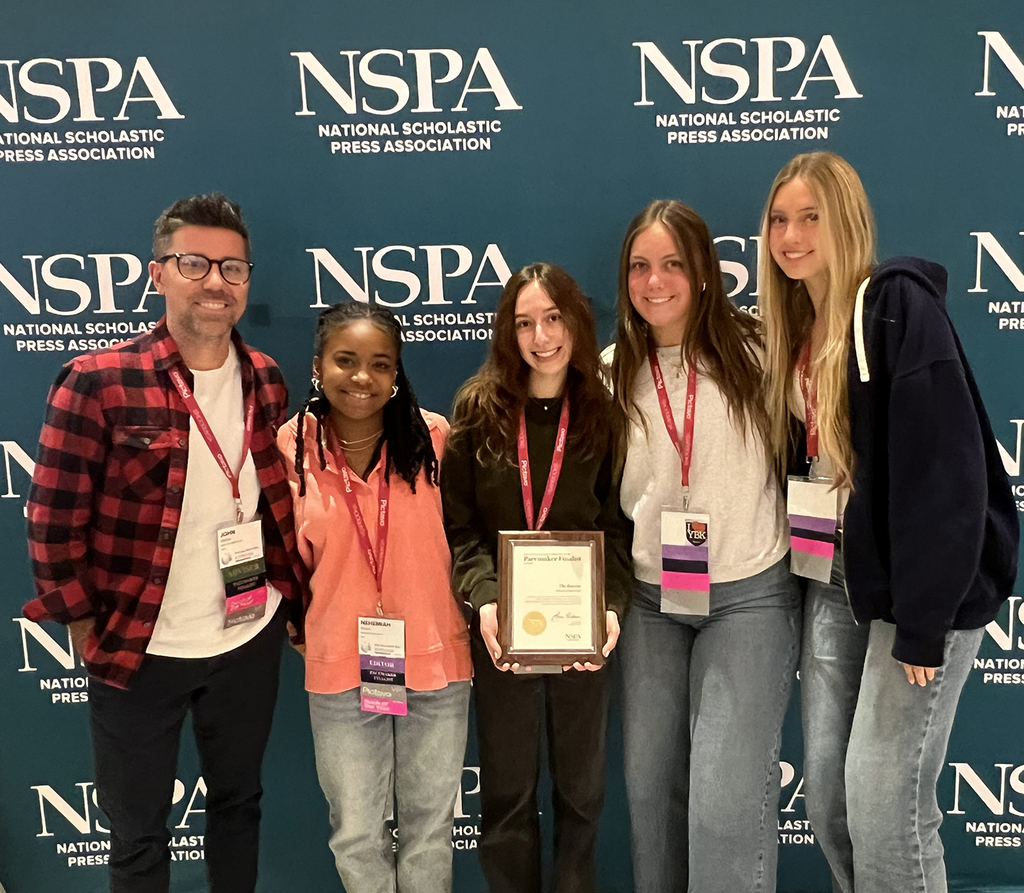 Yearbood advisor John Staber with his students Nehemiah Rivers, Payton Terronez, Claire Franzman, and Elle Harson at the National Scholastic Press Association conference