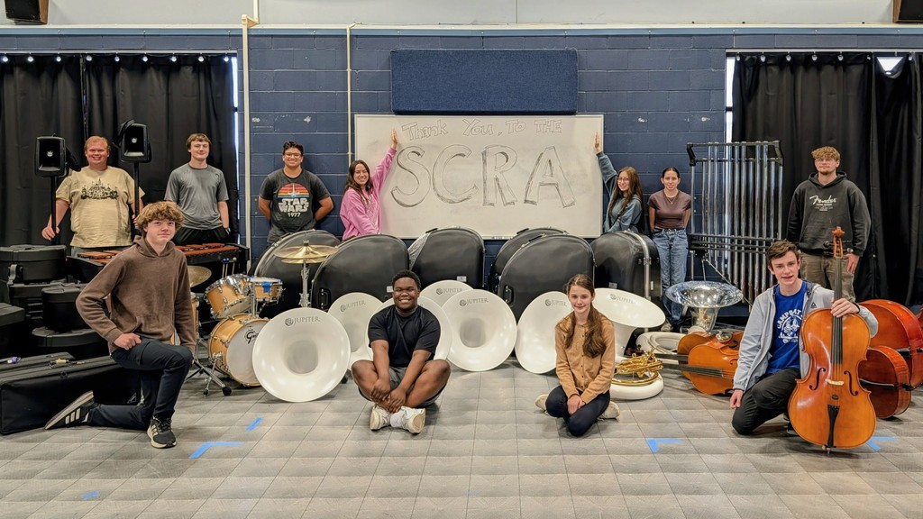 Music students showing off new band and orchestra equipment funded through an SCRA grant