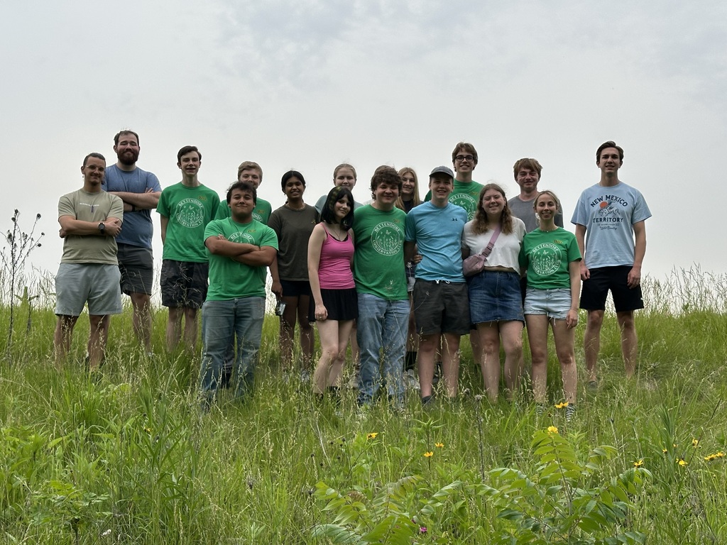 The BHS Conservation Club standing on a prairie hillside.
