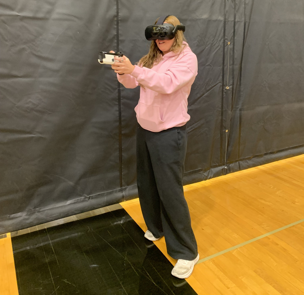 Student with speed camera and virtual goggles