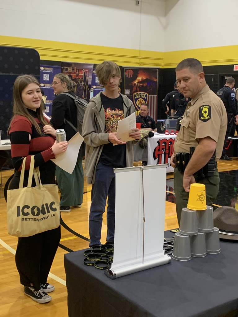 Students checking out the state police display