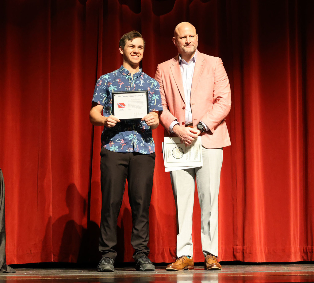 Zach Shay awarding the Bernie Saggau Award to Cash Dormire