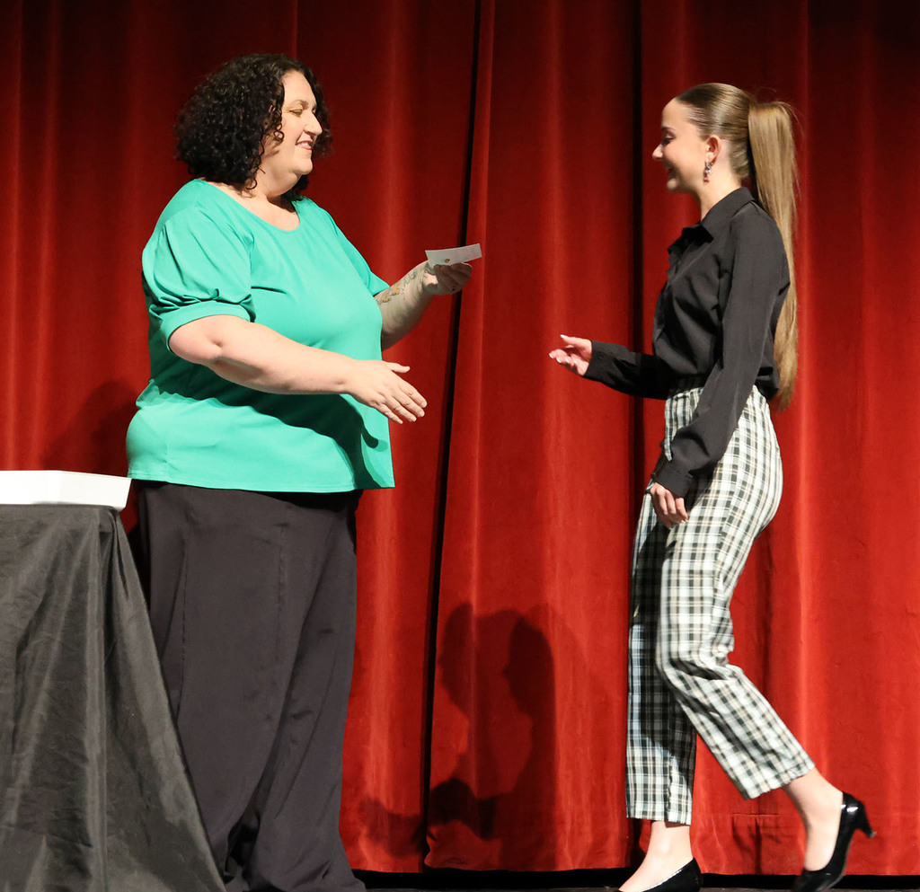 Dr. Anna Roeder awarding the Iowa Hospital Education & Research Foundation to Abigail Holland