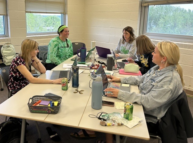 Teachers having a conversation at a table