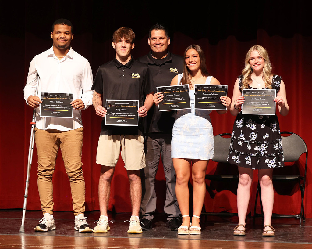 Armon Williams, Cody Trevino, Qendresa Selmani, and Kaitlynn Crump recieving wrestling scholarships