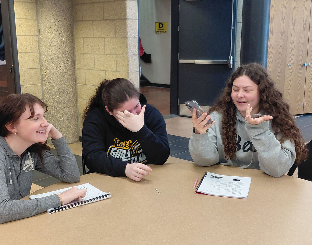 Three girls calling a grandpants and laughing