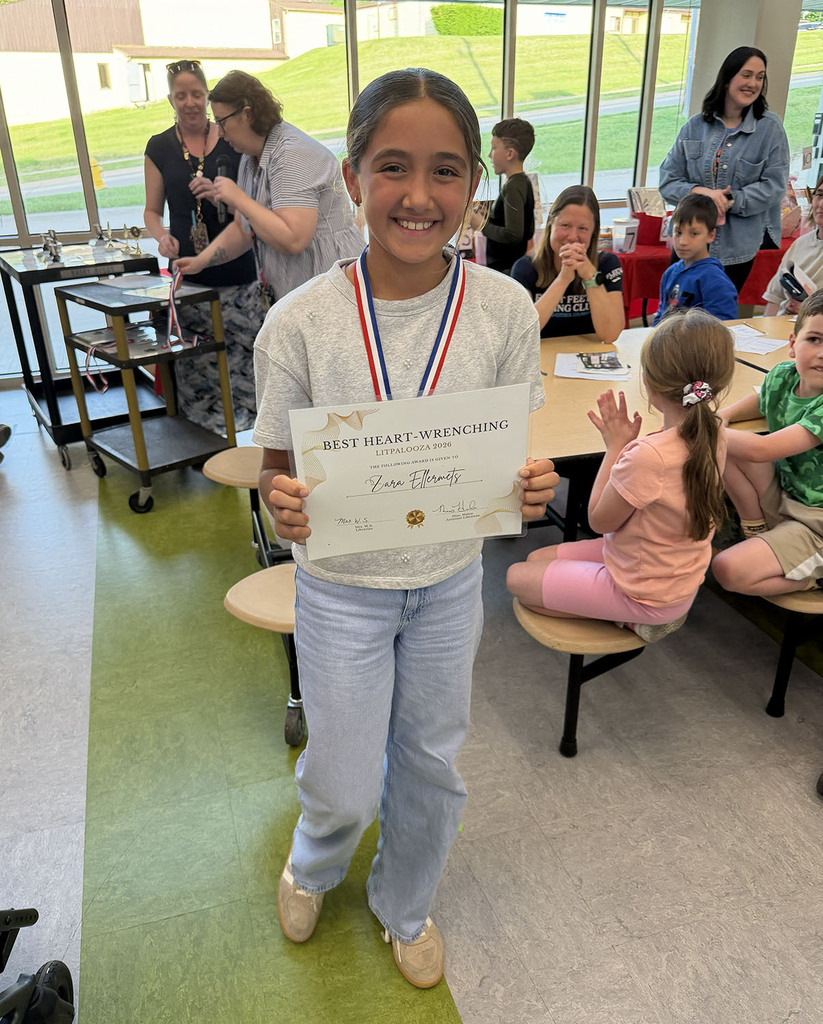 A girl with a certificate for Best Heart Wrenching