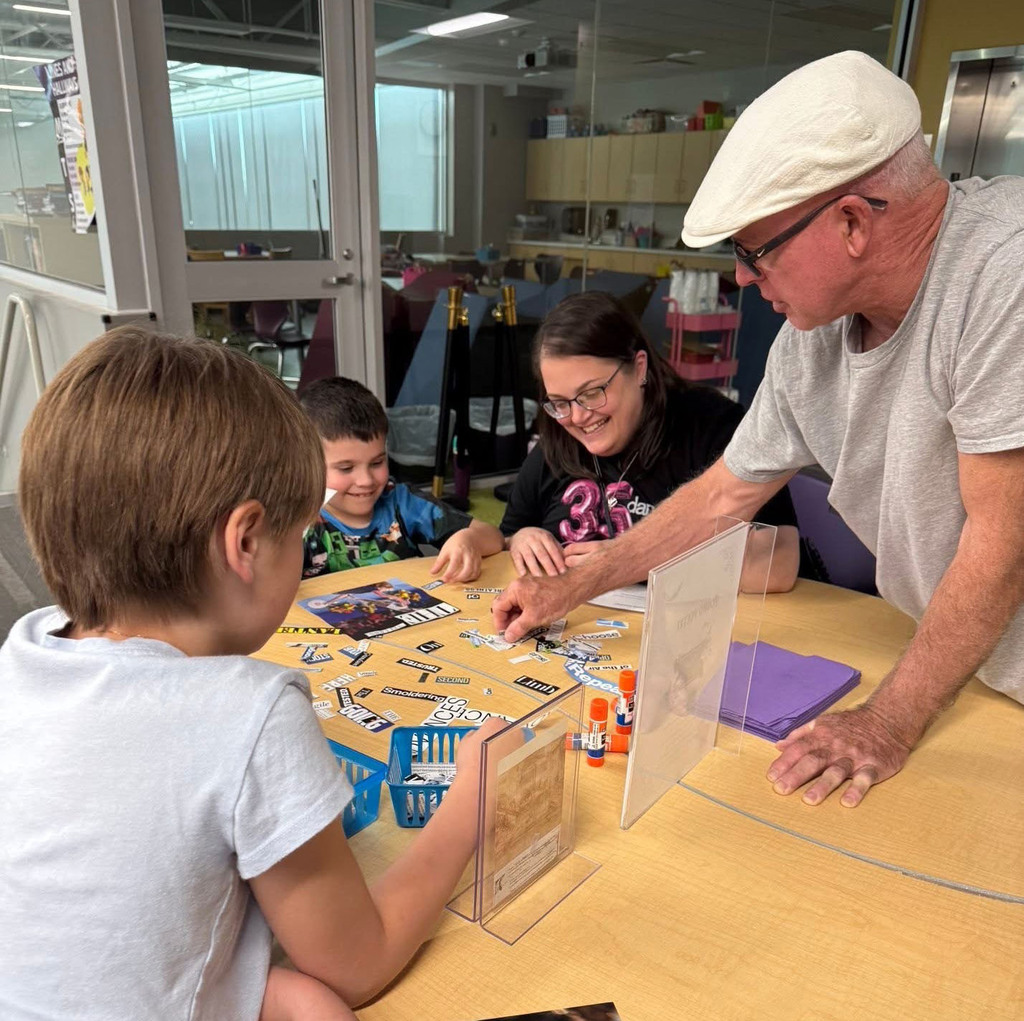 A family working on a project with their son.