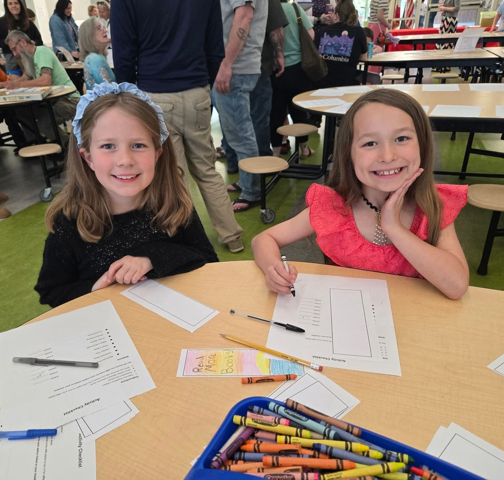 Two girls working on a project