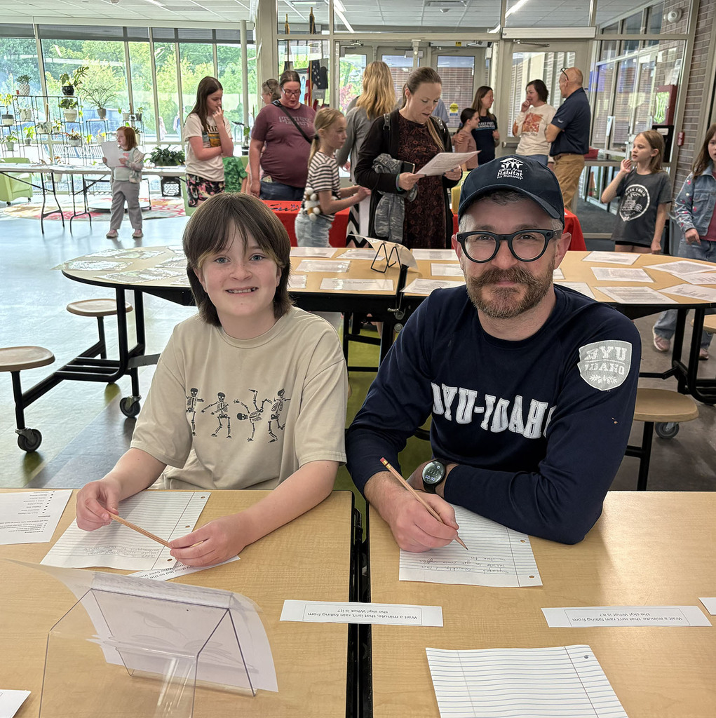 A family working on a  writing prompts