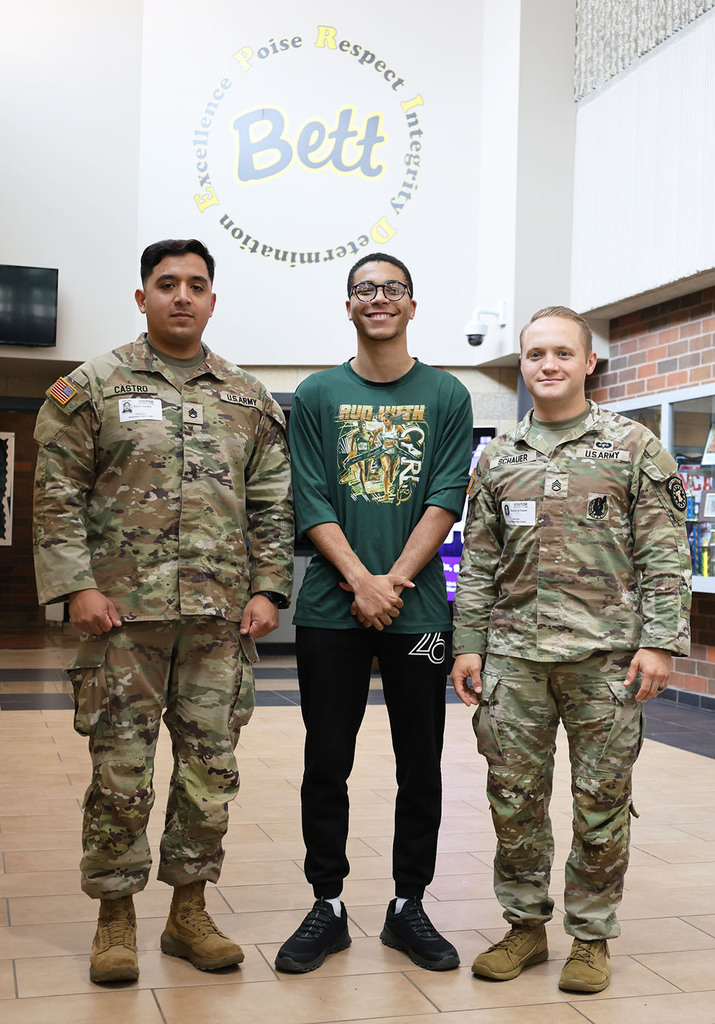 Tavian Willingham with two guests from the army