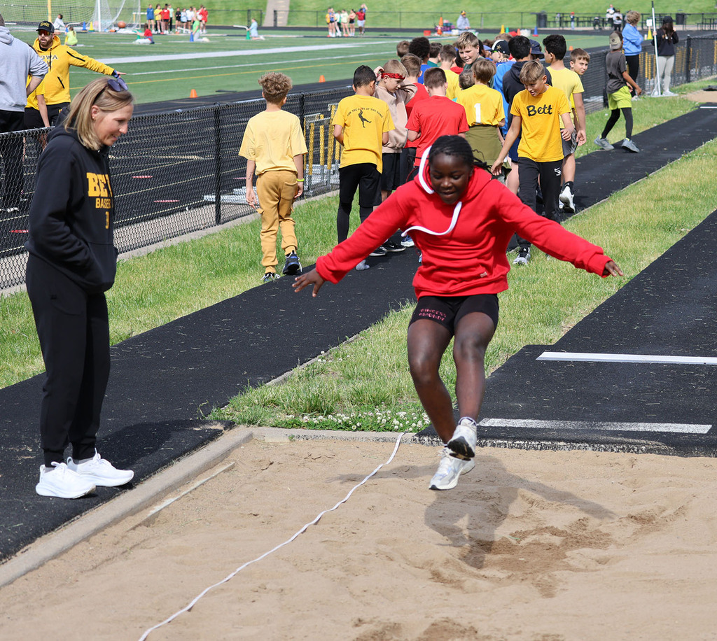 Girl landing a long jump