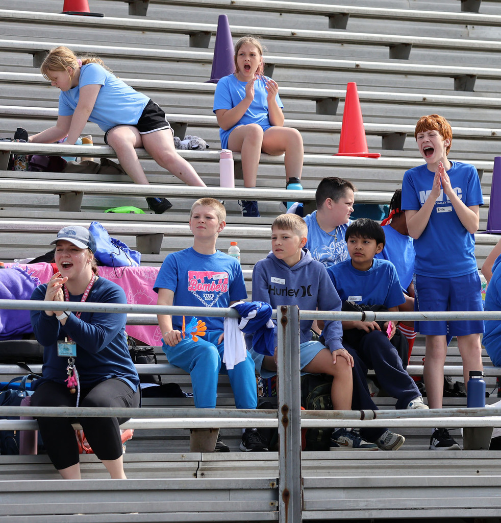 Fans cheering on the blue team