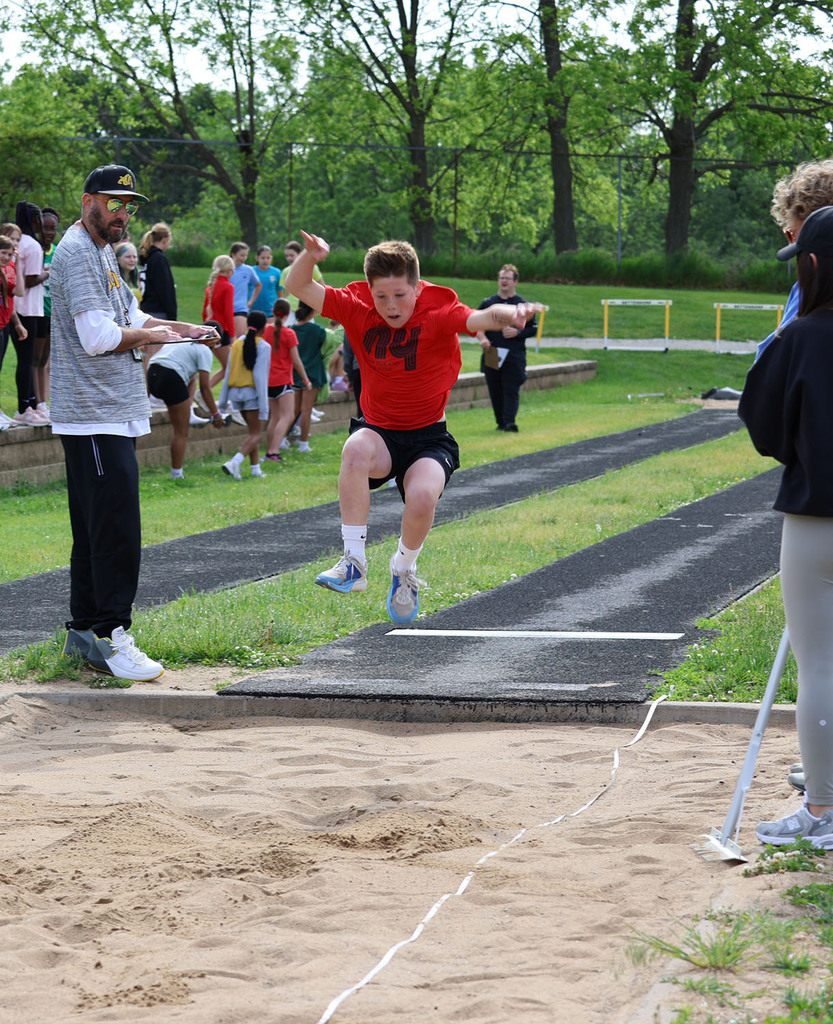 Boy landing a long jump