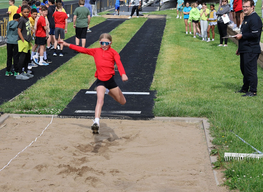 Girl landing a long jump