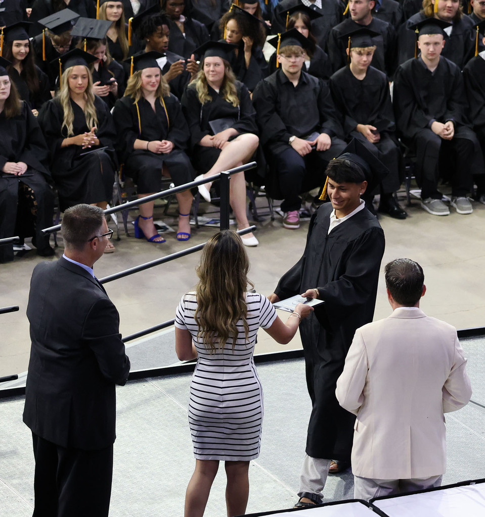 Student receiving his diploma