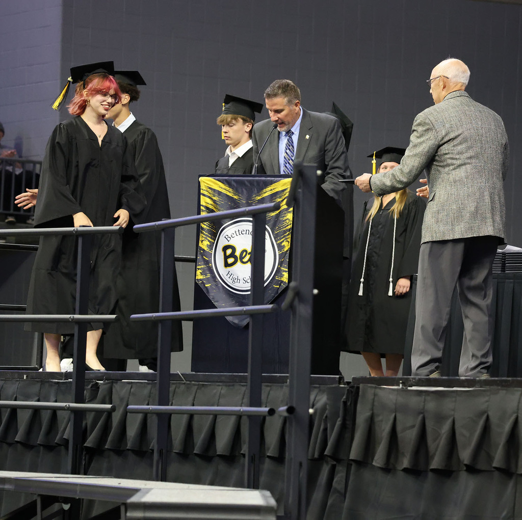 Girl receiving her diploma