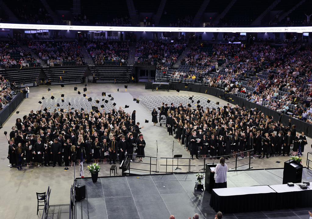 Students tossing their caps