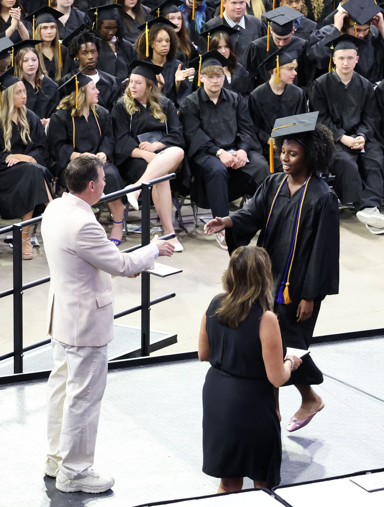 Student receiving her diploma