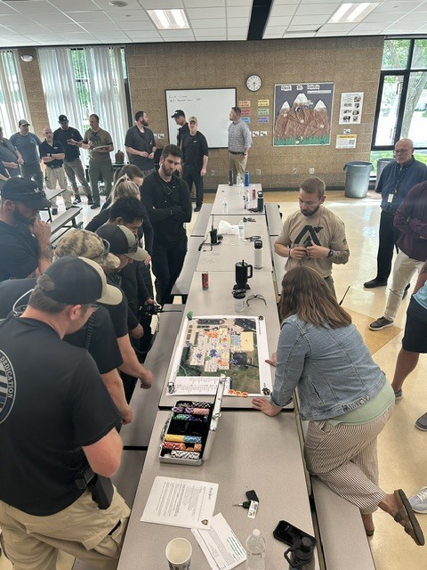 Bettendorf Police & Fire working with staff on intruder senarios using a facility map.