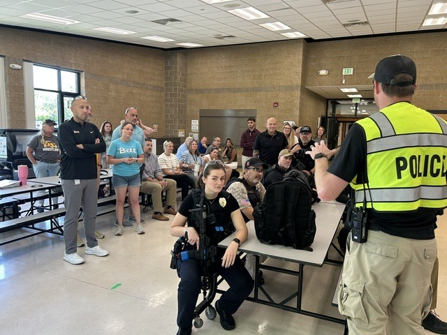 Bettendorf Police speaking with drill participants and observers