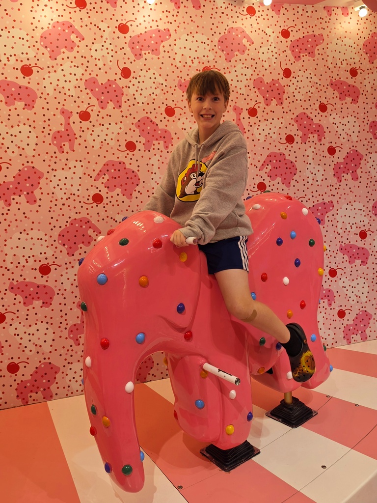 Andrew on a sprinkle covered elephant at the Ice Cream Museum