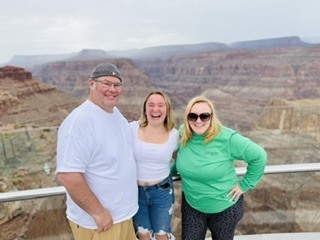 Abigail and in parents with the grand canyon in the background