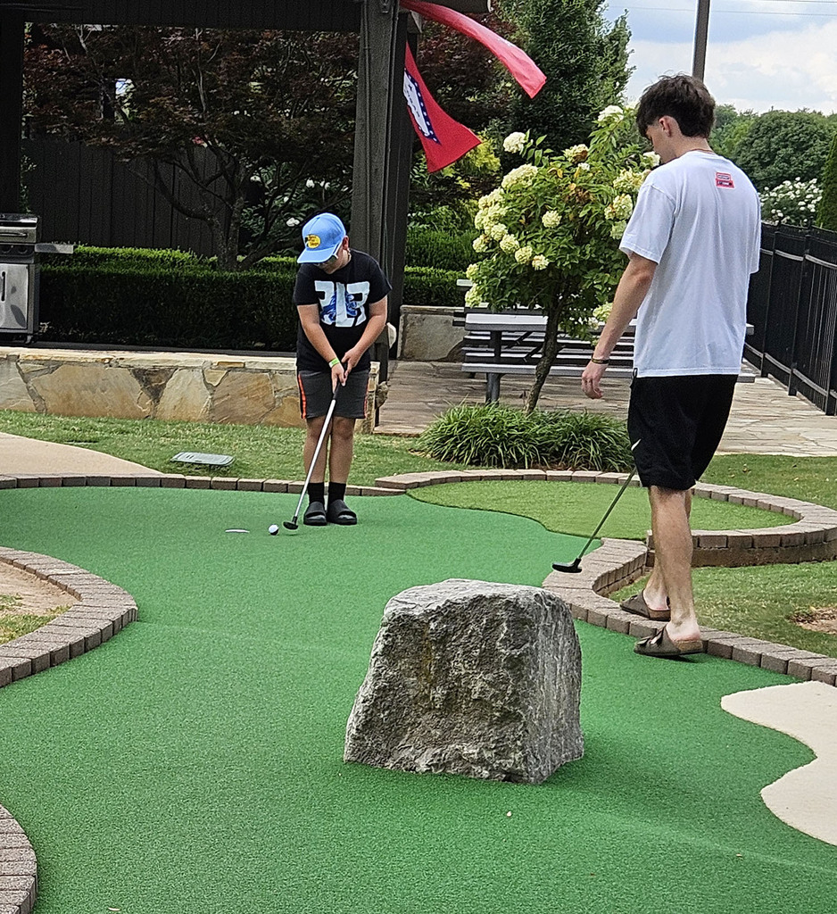 Nolan playing minigolf