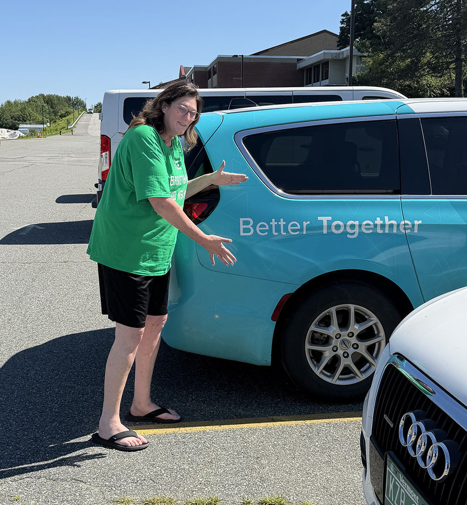 Stacey pointing out a vehicle with "Better Together" on it