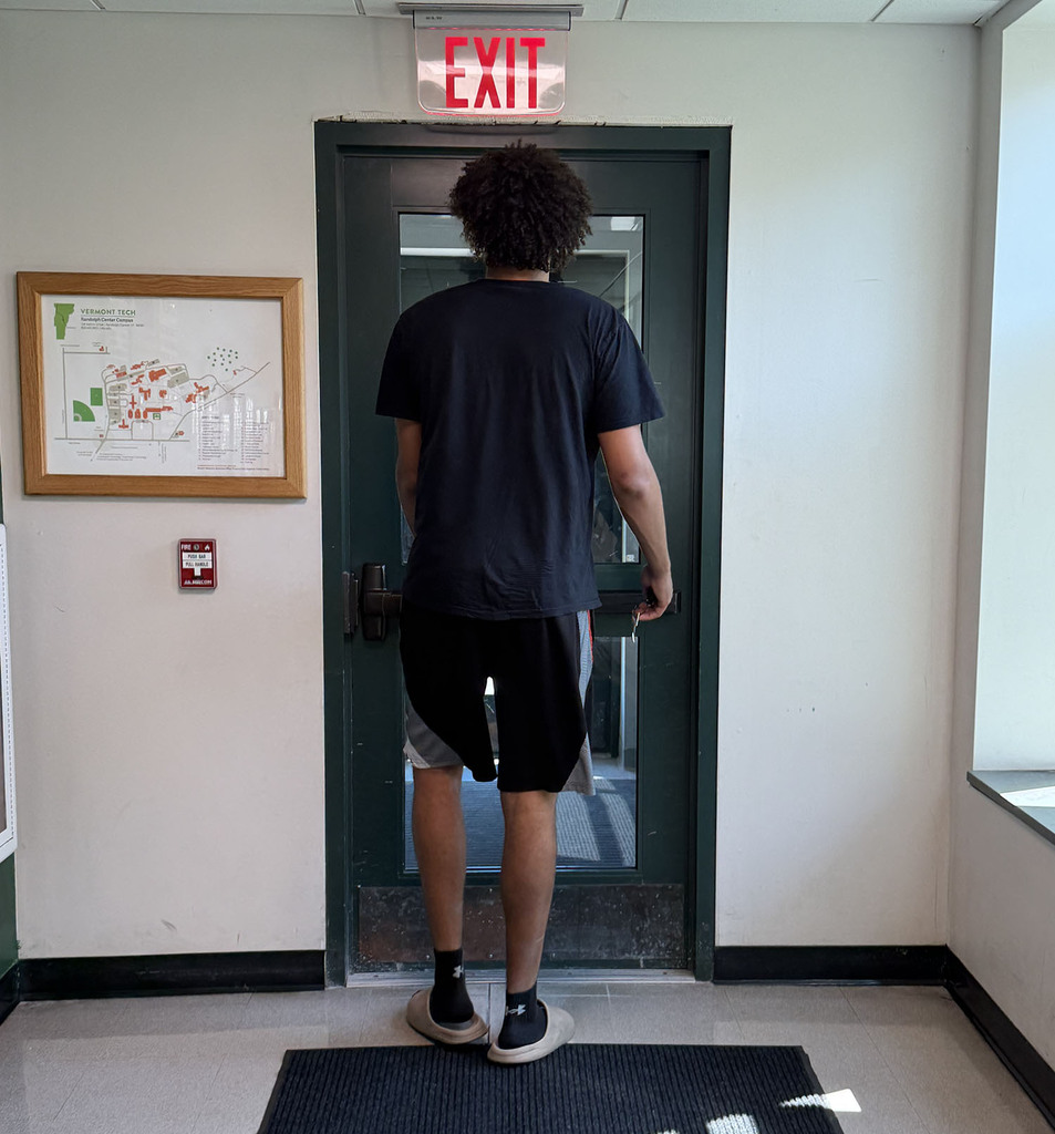 Jalen heading toward an exit door - practically topping the door.