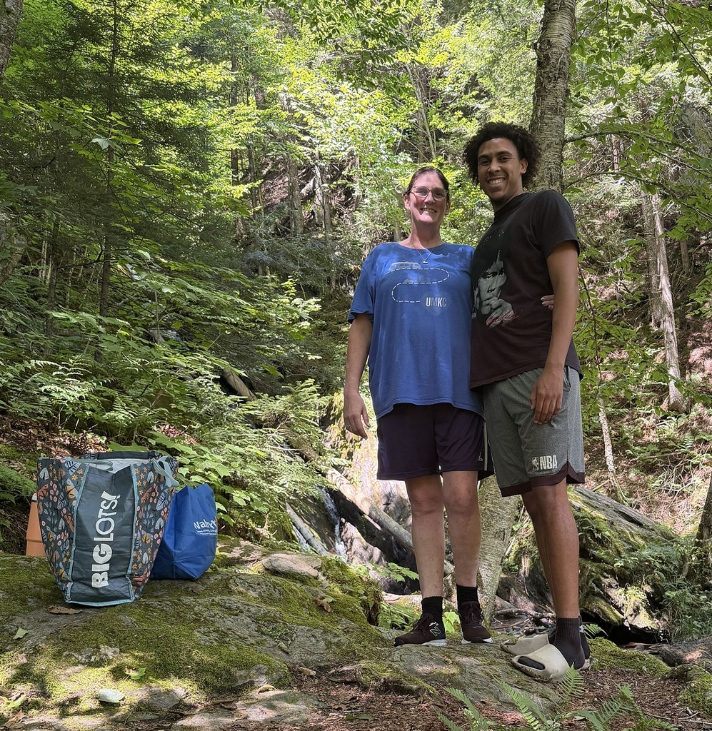 Stacey and Jalen hiking in a beautiful Vermont woods