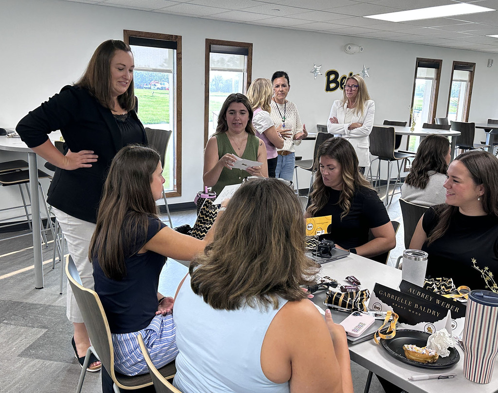 Neil Armstrong  Principal Heidi Burchardand Adriana Cruz visiting with a table of new teachers
