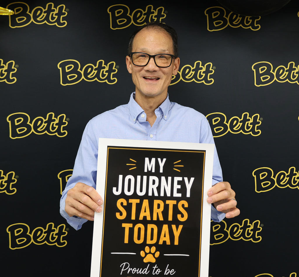Michael Louie with a sign: My Journey Starts today - paw print - Proud to be