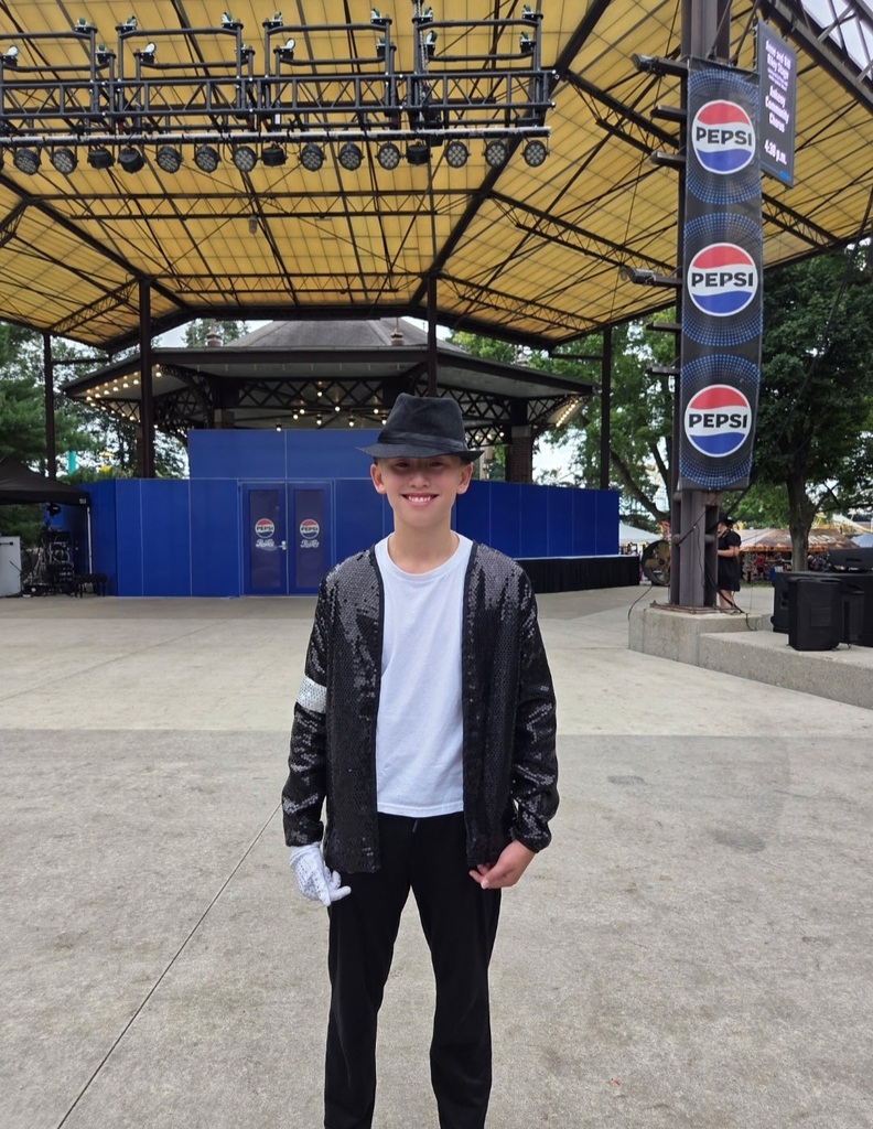 Liam decked out in his Michael Jackson look with the black pants and jacket, white t-shirt, black hat, and one white glove.