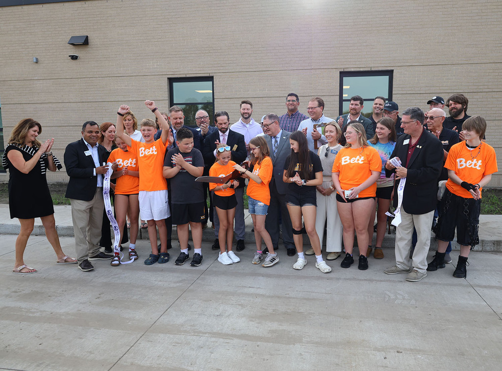 Excitment in the ribbon cutting grop for a successful ribbon cutting