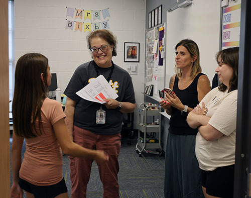Melissa Bixby visiting with a student