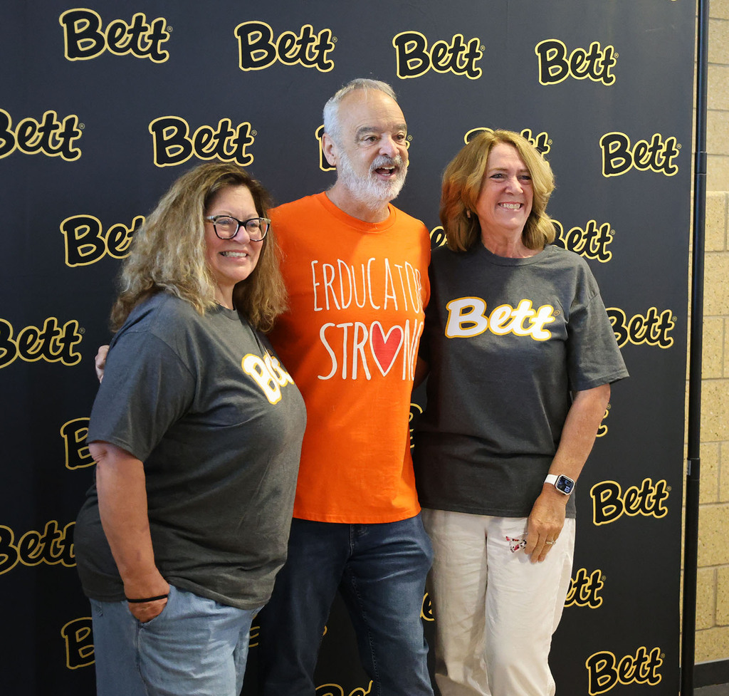 Gerry Brooks with a couple teachers getting their picture taken