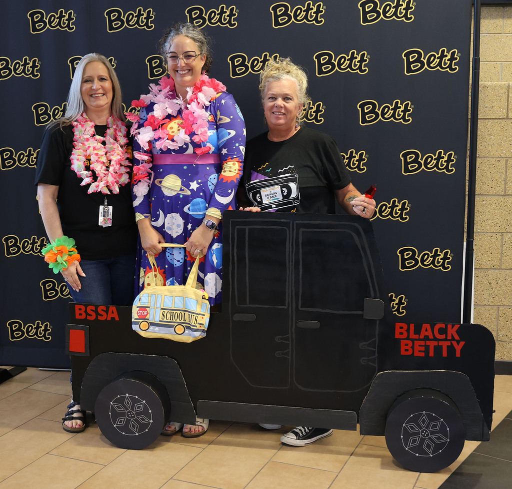 Our Union leaders: Melissa Laufenberg, Emily Cullison, and Stephanie Sanbdam in front of a cardboard Black Betty pickup truck