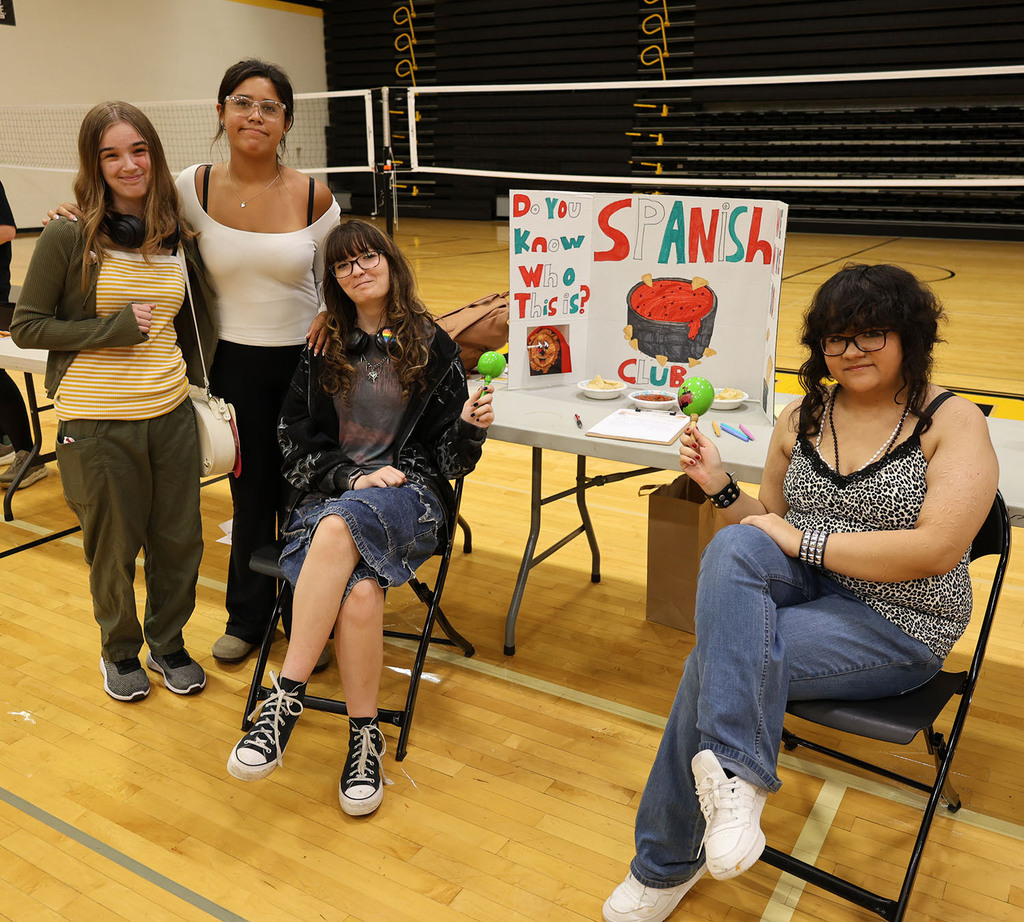 Students representing the Spanish club with salsa and chips