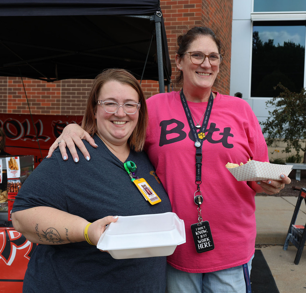 Two staff with their dinner choices