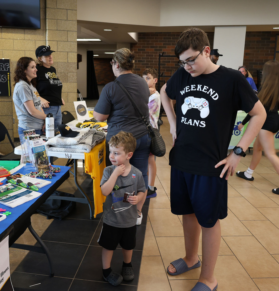 Students checking out a table display