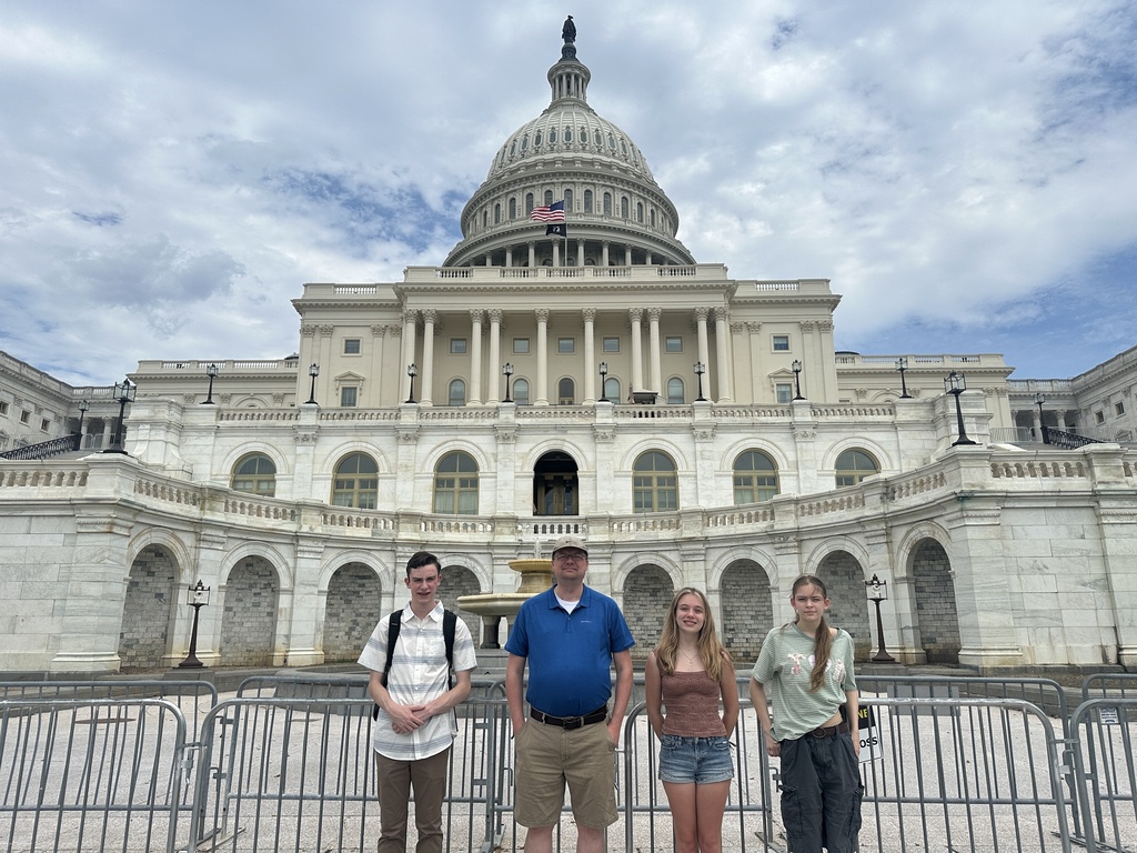 Mr. Rakin and students by the gate of the Capitol