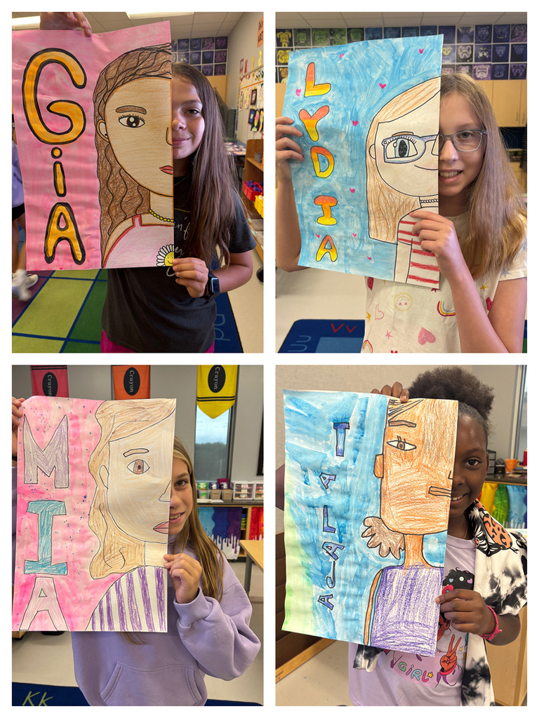 Students holding art work of half of their face with their namesin bubble letters next to the other half of their face