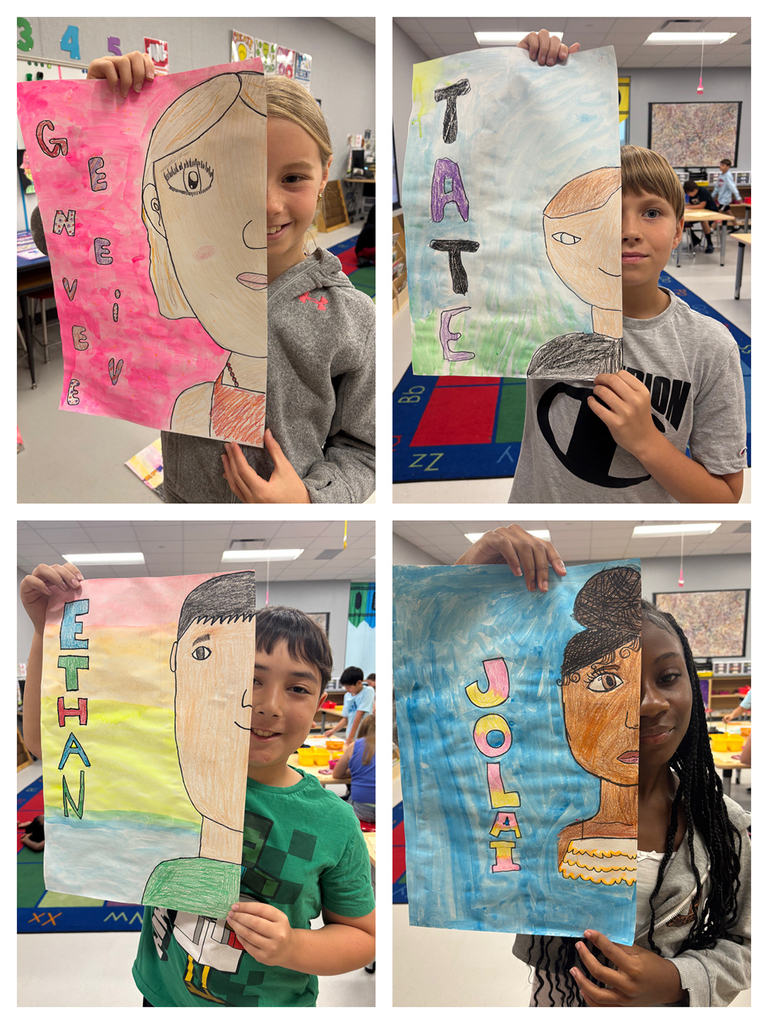 Students holding art work of half of their face with their namesin bubble letters next to the other half of their face