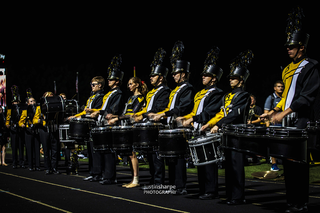 Drummers performing during a night football game