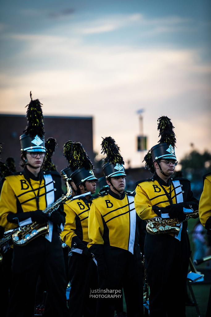 Marching band entering the field during a night football game