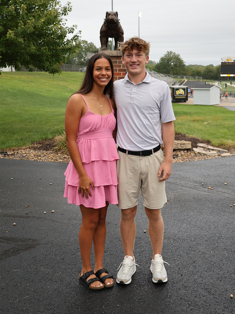 Addison Woelfel and  Jackson Giza with the bulldog statue in the background