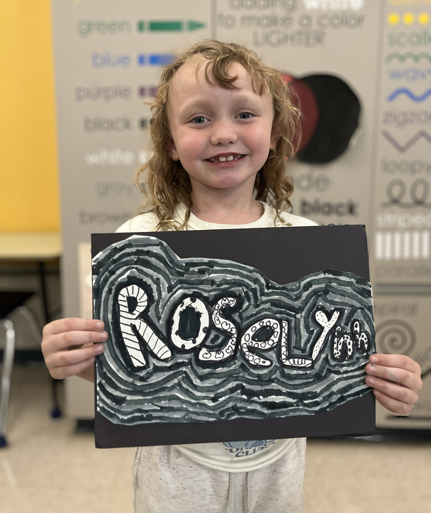 Roselynn smiling with her back, grey and white art design