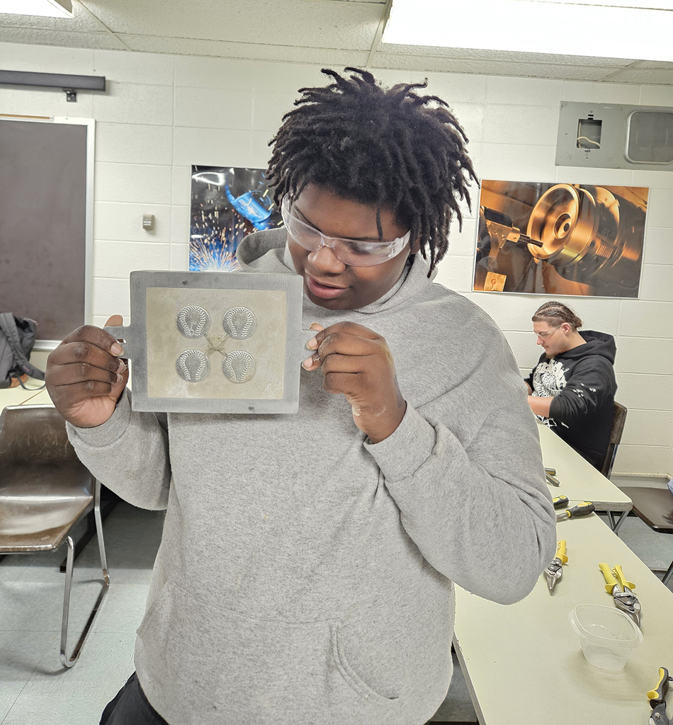 Student looking at his casting of four circles with a rope shaped like a horse shoe