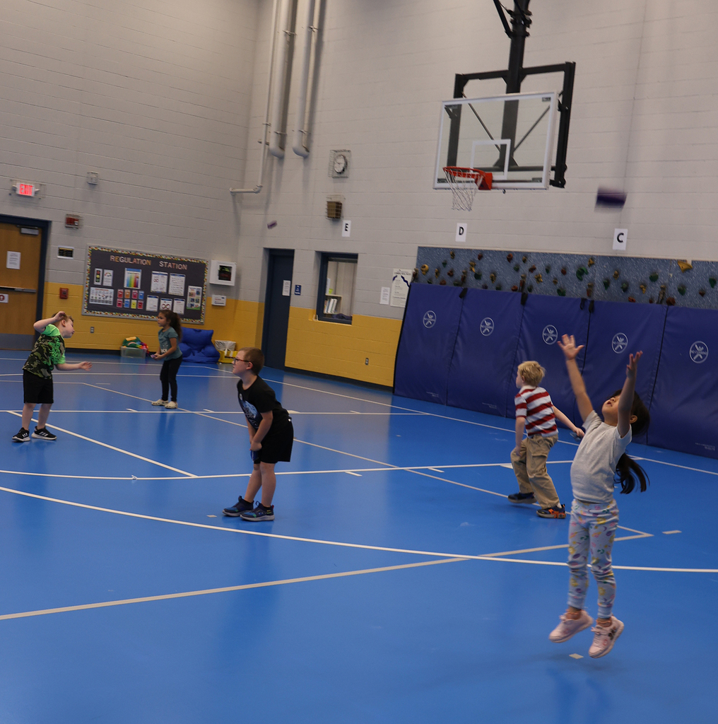 Student tossing and catching bags